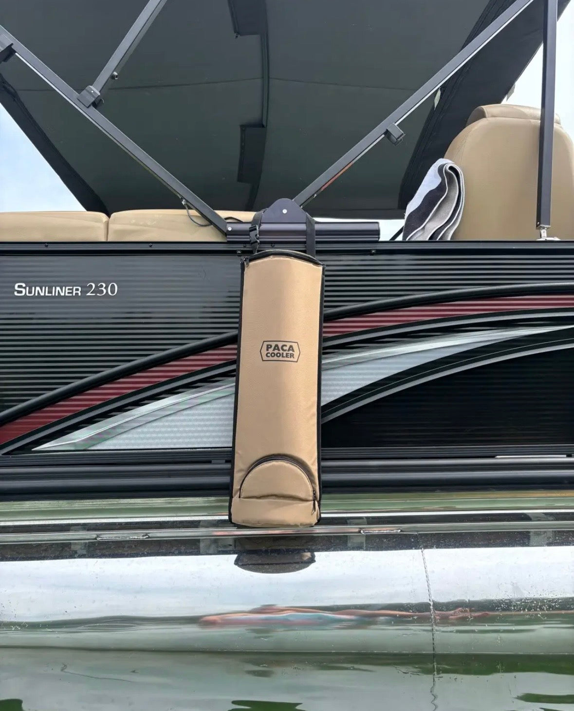 Tan Paca Cooler on a black pontoon boat. Photo credit Cletus T on TikTok.